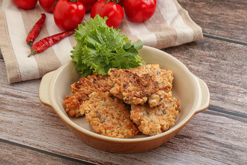 Fried salmonn cutlet in the bowl