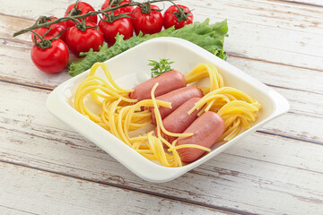 Mini sausages with pasta spaghetti