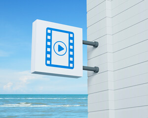 Play button with movie icon on hanging white square signboard over tropical sea and blue sky with white clouds, Business cinema online concept, 3D rendering