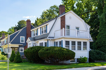 Two-story single-family homes exterior on a summer day in Brighton, Massachusetts, USA