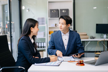 Fototapeta premium business people and lawyers discussing contract papers sitting at the table. Concepts of law, advice, legal services.