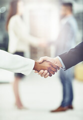 Handshake, team and business people in office with agreement, b2b deal or collaboration. Teamwork,...