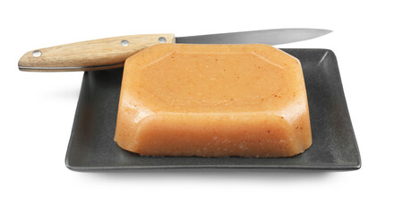 Delicious sweet quince paste and knife isolated on white