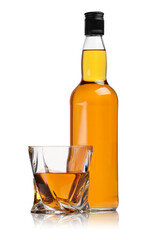Glass and bottle of whiskey isolated on white