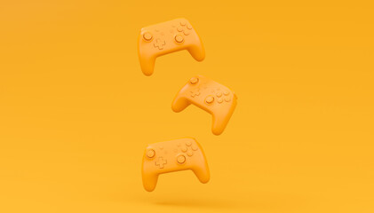 Video game joysticks or gamepads in plain monochrome yellow color background © Vasyl Onyskiv