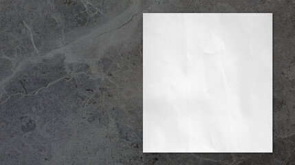 close up of white grunge paper placed on grey marble stone table with blank space for design. empty white paper sheet on rustic stone table in top view.