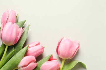 Happy Mother's Day. Beautiful tulips on light background, flat lay. Space for text