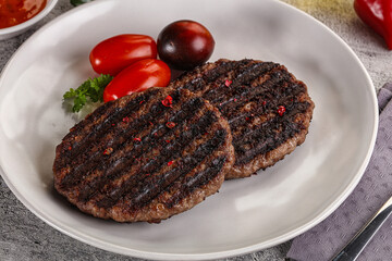 Grilled burger cutlet with sauce