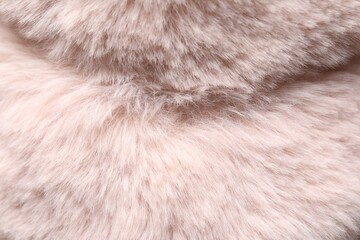 Texture of pink faux fur as background, closeup