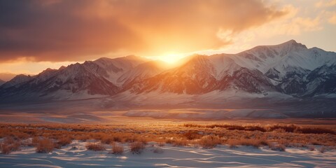 Majestic view of snow-capped mountains with the warm glow of sunset, conveying beauty and tranquility in nature
