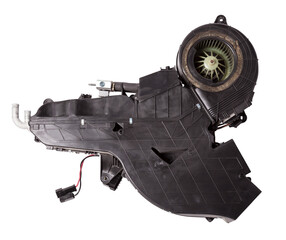 The body of the rear heater made of black plastic with an air conditioning system for repair and replacement on a car in a workshop on a white isolated background. Catalog of spare parts for vehicles