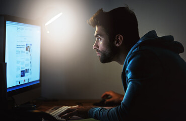 Man, computer and screen for web design at night with deadline, website development or coding at...