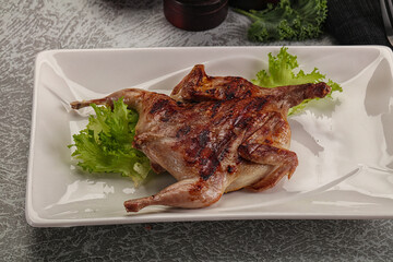 Grilled quail in the plate