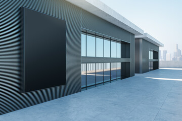 Sleek architectural facade with a large mockup space, perfect for advertising against a city skyline. 3D Rendering - 786012687