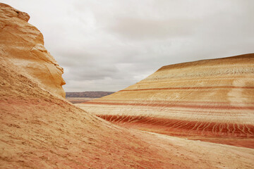 Unique geological feature known as tiger-striped mountains, showcasing layers of sedimentary rock...