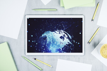 Top view of modern digital tablet display with abstract software development hologram and world map, global research and analytics concept. 3D Rendering