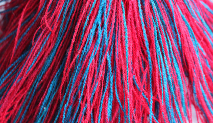 Pattern of red and blue braided threads macro shot stock photo for threads backgrounds
