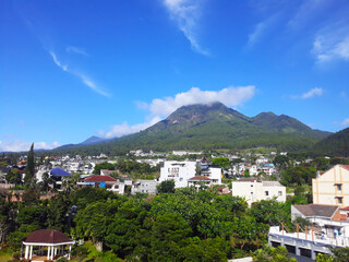 Fototapeta na wymiar view of the city under the hill during the day