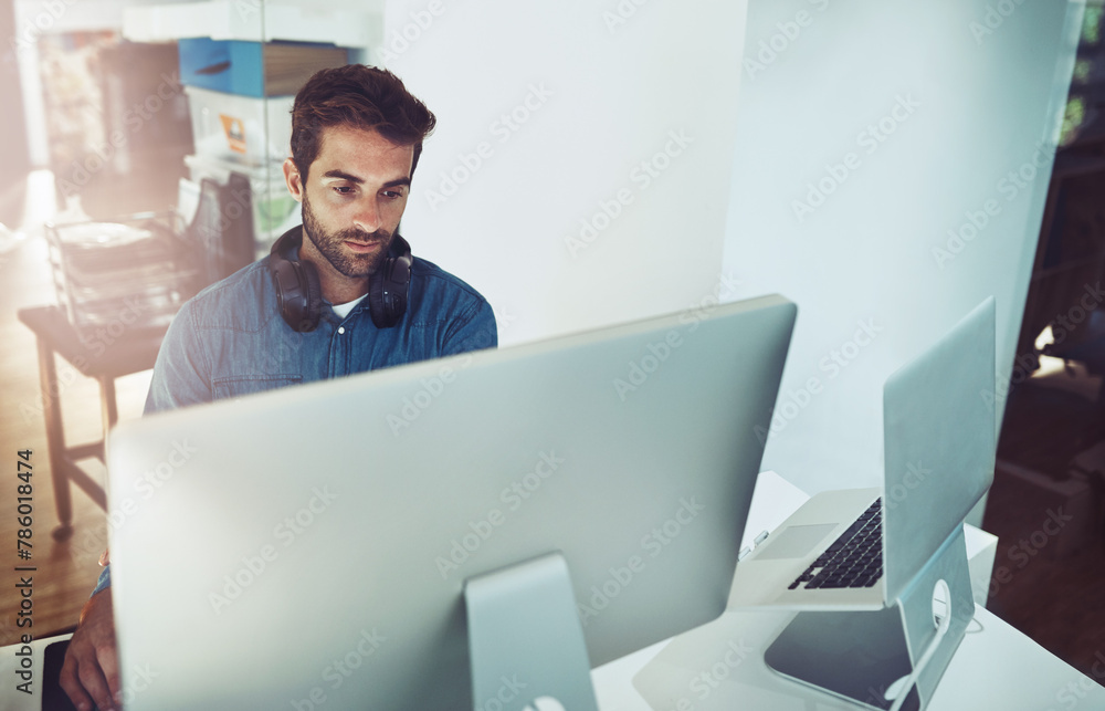 Poster Serious, computer and business man in office for planning, reading email or network online in creative startup. Pc, programmer and code software for information technology, internet or cyber security