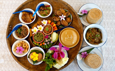 Northern Thai cuisine food set. Pork curry, chilli dip, minced pork salad, soft boiled vegetables...