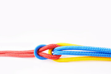 Colourful, ropes and tied for together in studio to represent unity, connect and trust. Secure,...