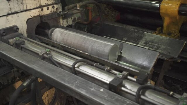 Heap of aluminium in aluminum factory.Billets of aluminium vertical video footage