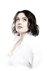 Portrait of a woman with dark hair, dressed in a white shirt, done in a high key.