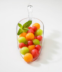 watermelon and melon pearls on a dispenser