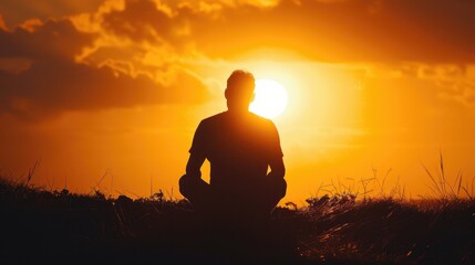 A thought provoking photograph of a man sitting in front of the sun creating a touching silhouette Ideal for projects delving into self reflection and mindfulness - obrazy, fototapety, plakaty