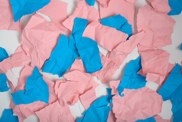 Crumpled and torn pieces of pink and blue paper. Background, texture