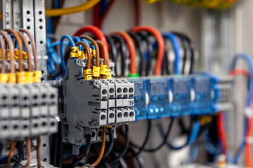 Electrical panel with fuses and contactors, close-up.