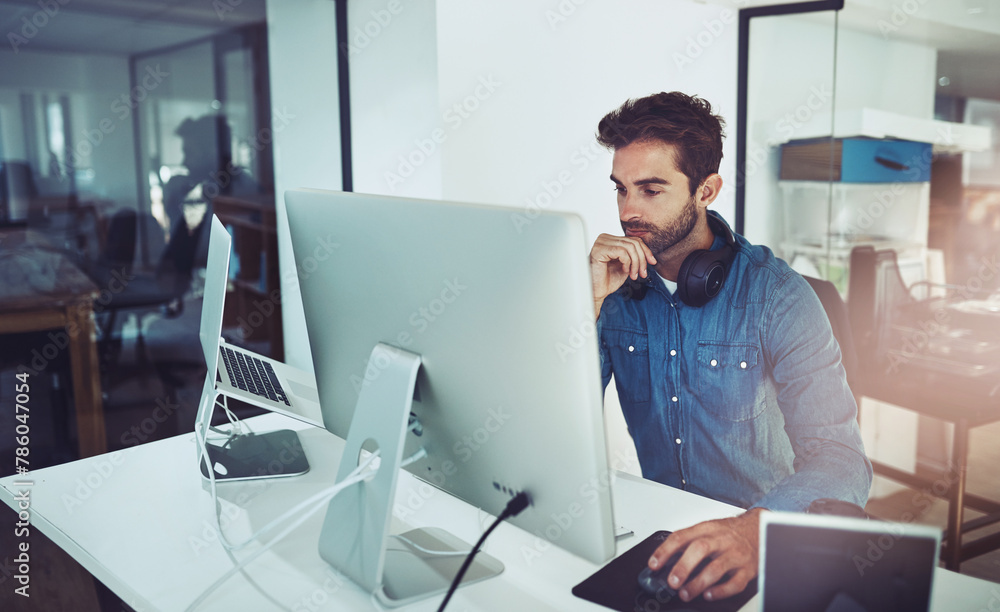 Poster Thinking, computer and business man in office for decision, reading email or problem solving in creative startup. Pc, serious programmer or planning solution, reflection or vision at desk for IT idea