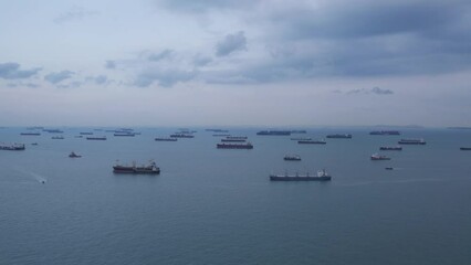 View of many logistic transport freight container ships in the sea.