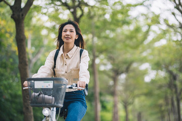 Asian woman renting shared bicycle in city