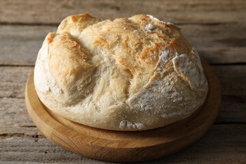 Freshly baked sourdough bread on wooden table