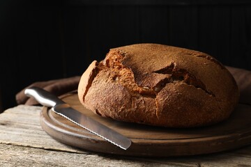 Freshly baked sourdough bread on wooden table