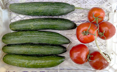 Tomatoes and cucumbers, vegetables. 