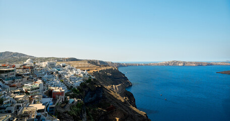 Panoramic view of Thira (Fira), the capital city of Santorini, greek village situated on the cliff,...