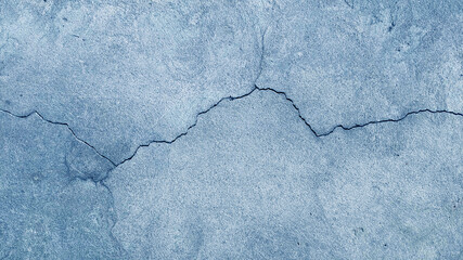Blue wall texture background. Crack wall texture. Cracked concrete wall covered with cement surface as background. Wall fragment with scratches and cracks.	
