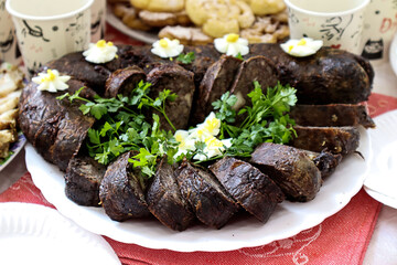 Blood sausage with parsley sprigs