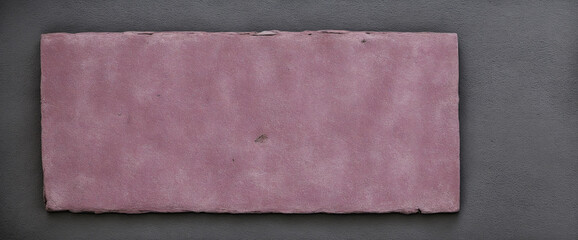 Pink heart on rustic black anthracite grey concrete stone texture wall background with copy space for your own design
