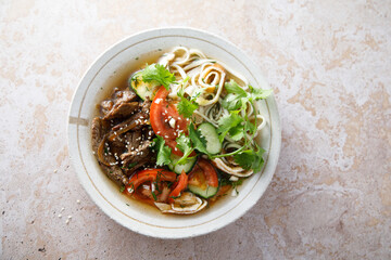 Traditional Korean soup with noodles and beef