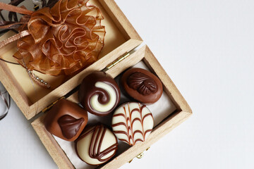 set of chocolates in a gift box on a white background

