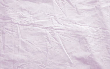 Top view of wrinkles on an unmade bed sheet after waking up in the morning. - 786070885