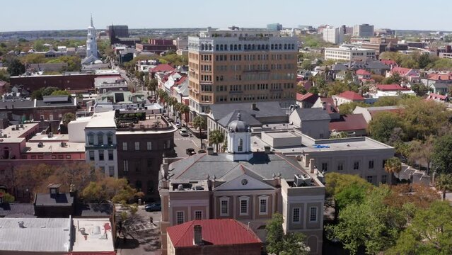 Close-up panning aerial shot of the historic Old Exchange and Provost Dungeon building in the French Quarter of Charleston, South Carolina. 4K