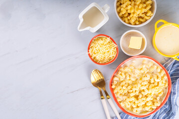 Creamy mac and cheese with ingredients for cooking