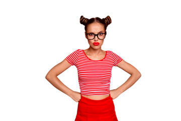 Strict teacher! Portrait of grimacing offended young gorgeous woman model with with hands on waist and bun hairstyle isolated on red background
