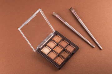 Natural colored eye shadow makeup palette with brush. Woman cosmetic and beauty product, eige color eyeshade pattern