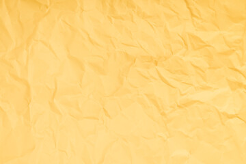 Yellow crumpled paper texture background with space paper for text.