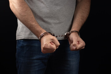 Prisoner male hands criminal with handcuffs